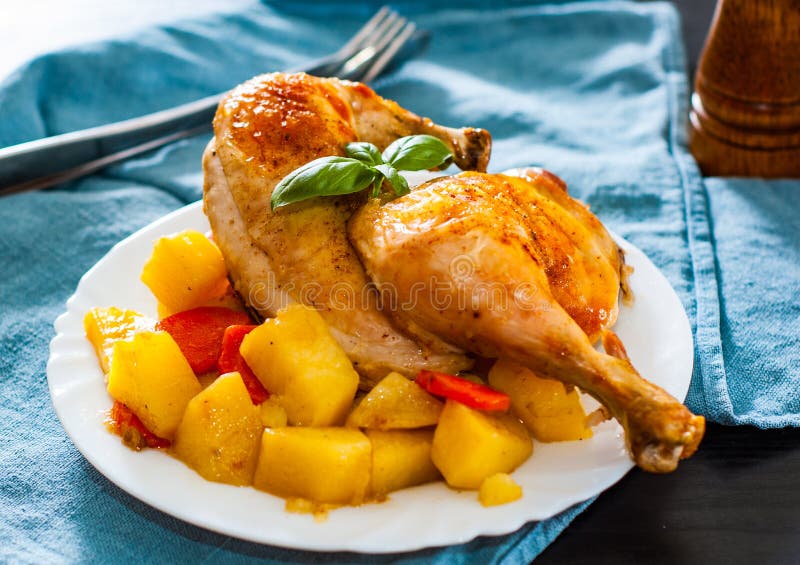 Roasted Half Chicken with Carrots, Onions and Potatoes Served on a