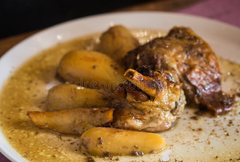 Roasted Lamb Leg with Potatoes, Rice and Salad with Vegetables Stock