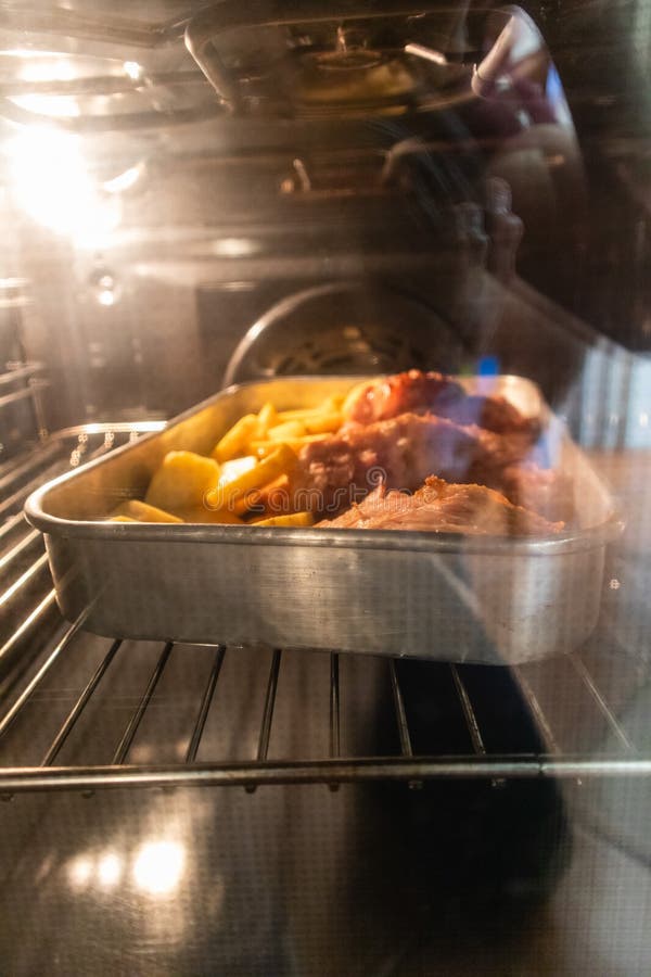 Roasted Meat and Potatoes Inside an Oven Stock Photo Image of dinner, dish 186561614