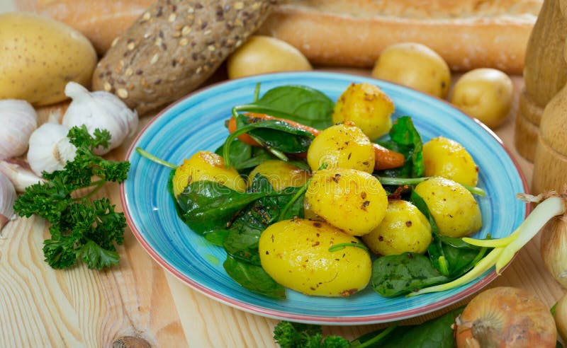 Roasted New Potatoes with Spinach Stock Photo - Image of menu, garlic