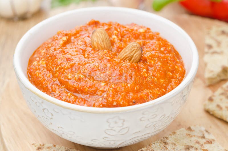 Roasted pepper dip with almonds and garlic closeup