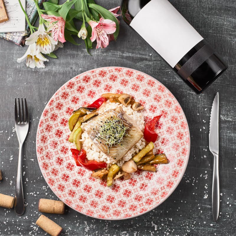 Roasted Pike perch perch with vegetables and rice risotto royalty free stock photo