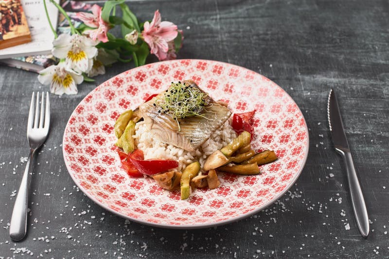 Roasted Pike perch perch with vegetables and rice risotto royalty free stock images