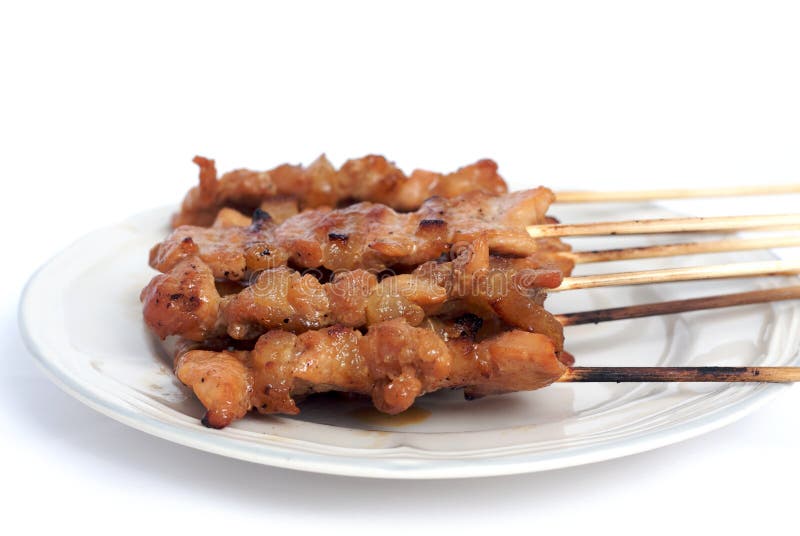 Roasted pork in wood stick on dish in isolated. Roasted skewer grill stock images, royalty-free photos and pictures
