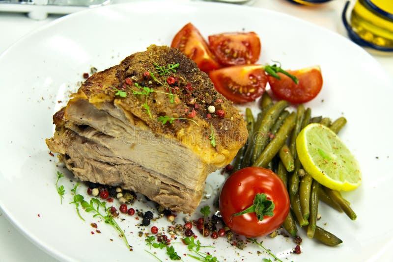 Roasted pork cutlet with tomato salad