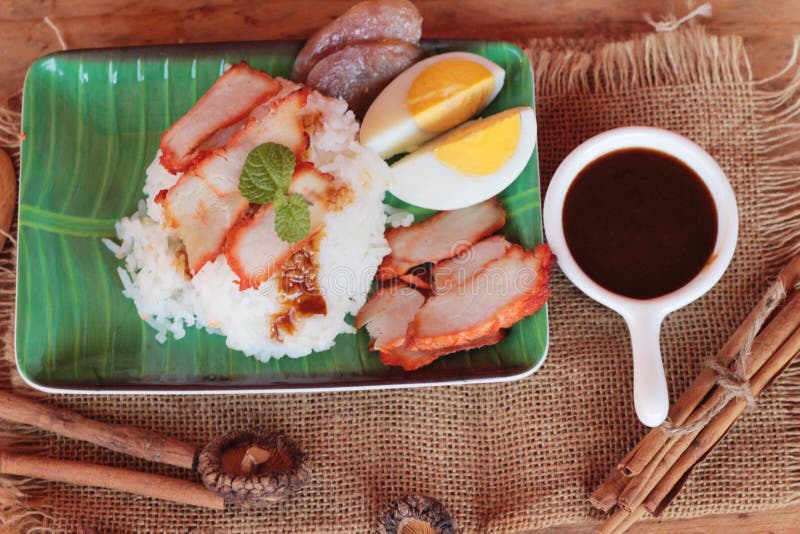 Crispy Roasted Pork Stir Fry with Vegetables and Rice. Stock Photo