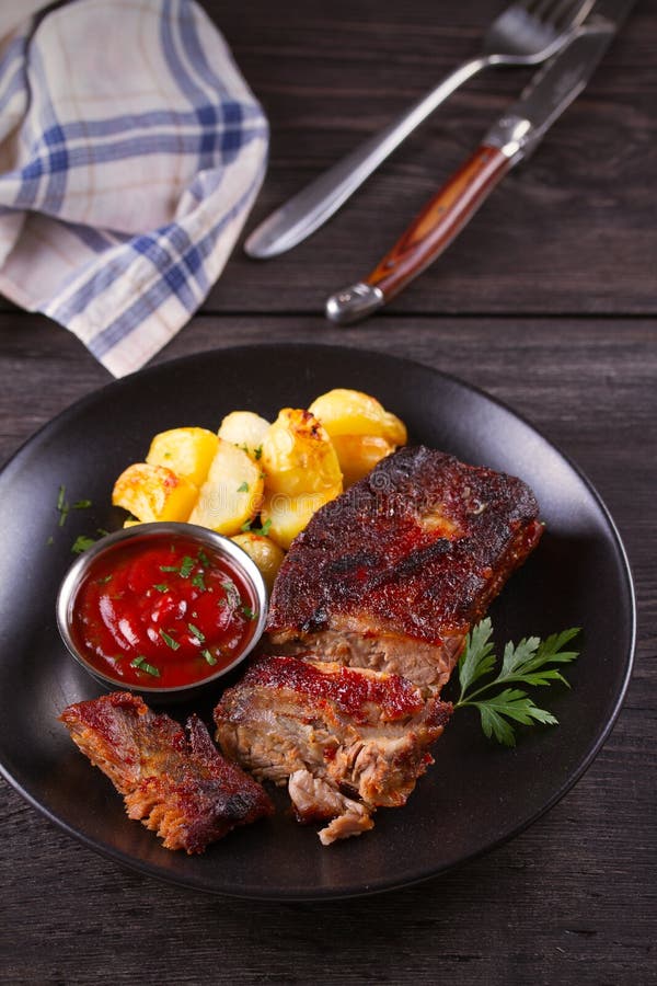 Pork Spare Ribs with Potatoes. Grilled Stock Image - Image of dinner, backbone: