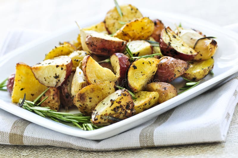 Roasted potatoes. Herb roasted potatoes served on a plate stock images