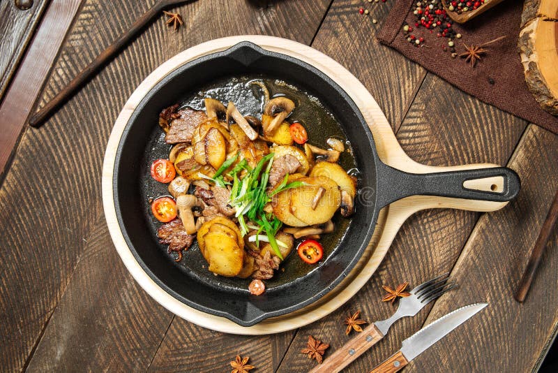 Roasted Potatoes and Beef Meat in Cast Iron Pan Stock Image Image of cast, closeup 195992957