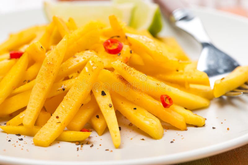 Roasted pumpkin with lime and chilli, selective focus, close-up