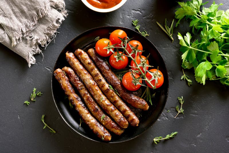 Roasted sausages and cherry tomatoes