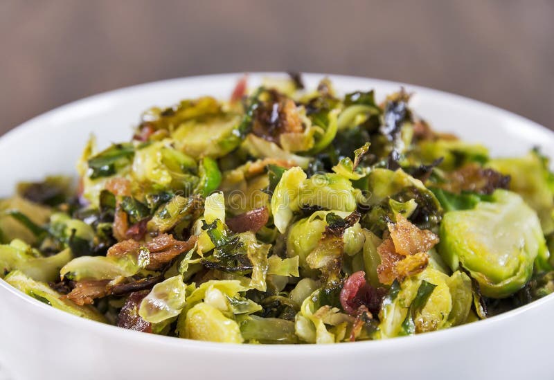 Roasted shaved brussels sprouts with crumbled bacon royalty free stock photo Roasted shaved brussels sprouts with crumbled bacon royalty free stock photo
