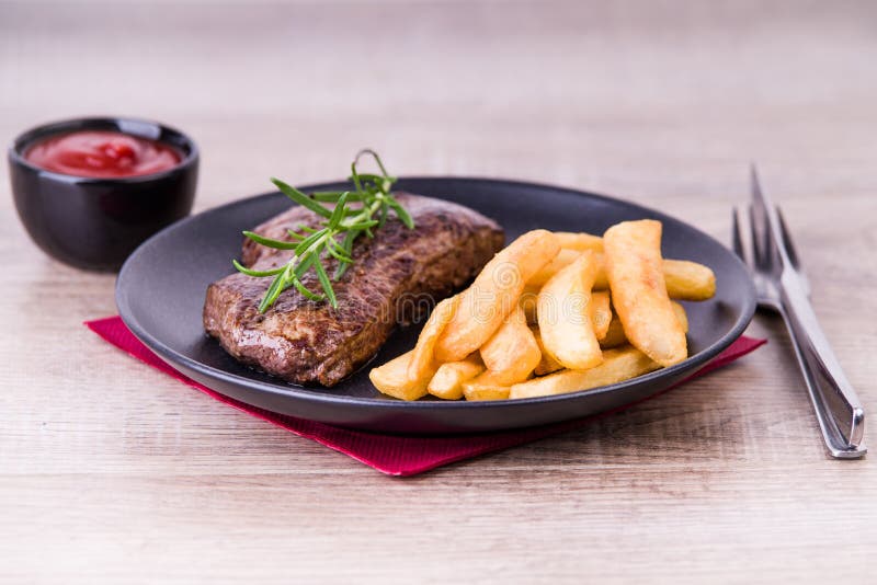 Roasted Steak with French Fries and Onions Stock Image Image of herb