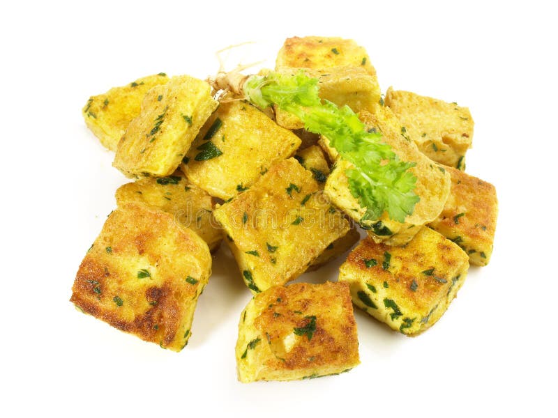 Roasted Tofu Cubes with Curry on White Background Isolated Stock