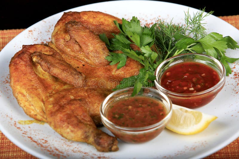 Roasted whole chicken on a plate