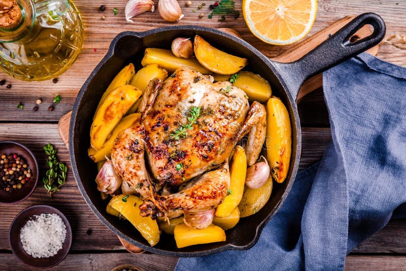Roasted Whole Chicken with Potatoes and Thyme Stock Photo Image of