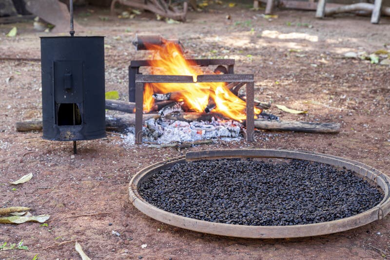 Roasting Coffee the Old Farm Way, Manual Roaster, Wood Fire Stock Photo