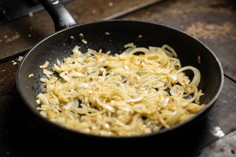 Roasting Onions. Chopped Onions are Fried in a Pan Stock Photo Image
