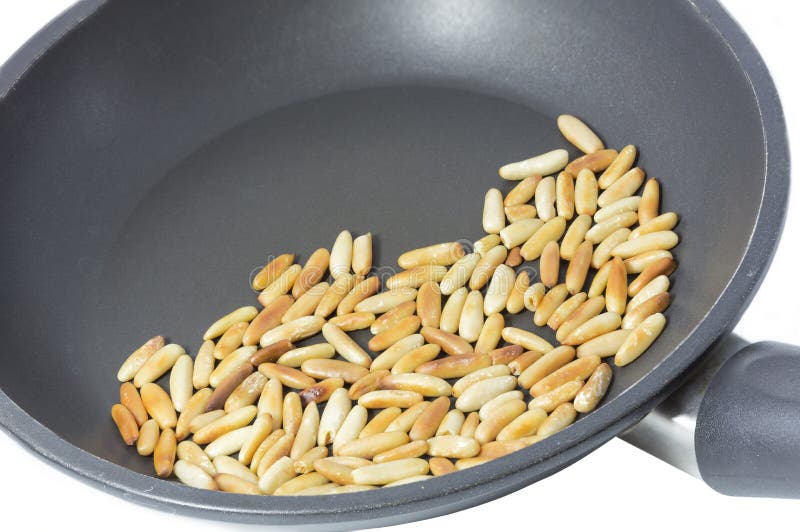 Roasting Pine Nuts in a Frying Pan Stock Photo Image of brown, food