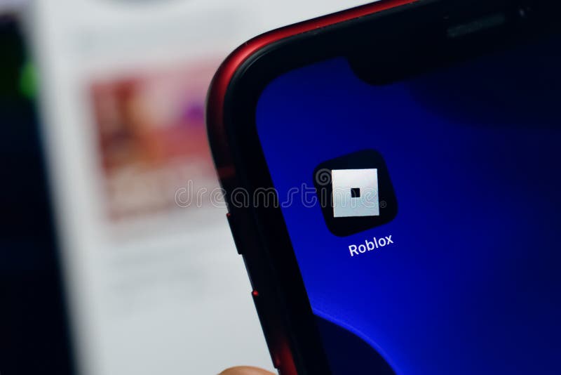 Person holding smartphone with website of US video games company Roblox  Corporation on screen in front of logo. Focus on center of phone display  Stock Photo - Alamy