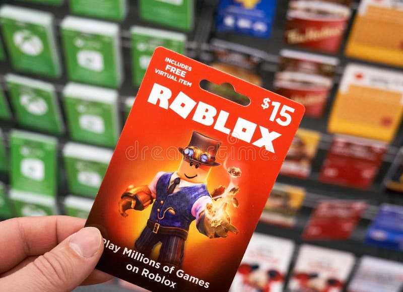 Roblox Gift Card in a Hand Over Gift Cards Background Editorial Photography  - Image of company, popular: 177165012