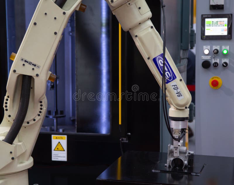 Robot arm perform loading / unloading object royalty free stock photo