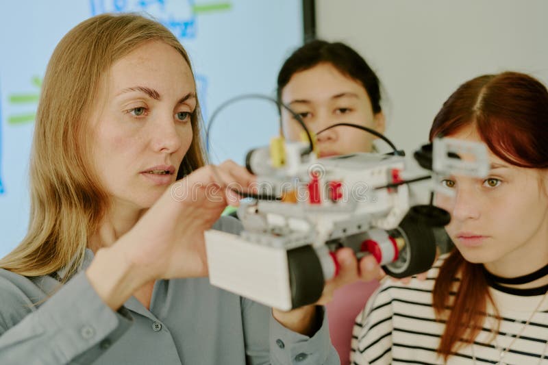 Robot in hands of teacher stock photos