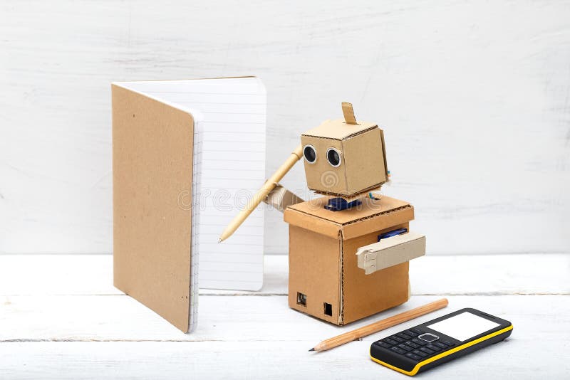 robot holding a pen and writing in a notebook. Artificial Intelligence royalty free stock photography robot holding a pen and writing in a notebook. Artificial Intelligence royalty free stock photography