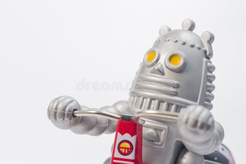 A robot toy is riding bicycle royalty free stock photos A robot toy is riding bicycle royalty free stock photos