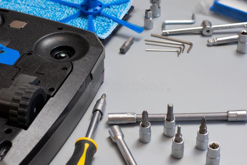 Robot Vacuum Cleaner. Copy Space. Vacuum Cleaner Robot Repair on Grey