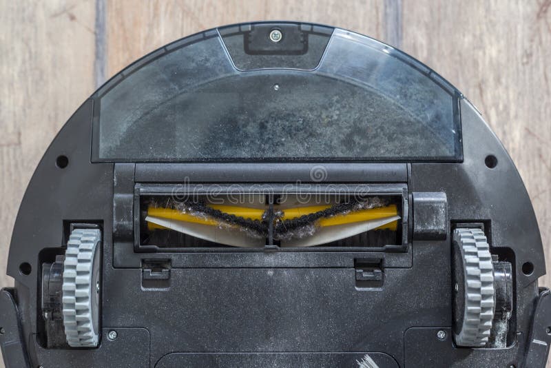 Bottom of a Robot Vacuum Cleaner Wheels and Brushes Stock Image