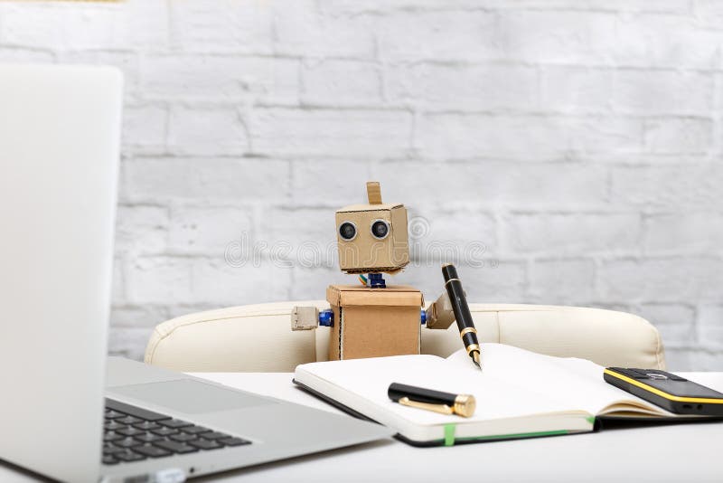 Robot working at a computer; workplace royalty free stock photography