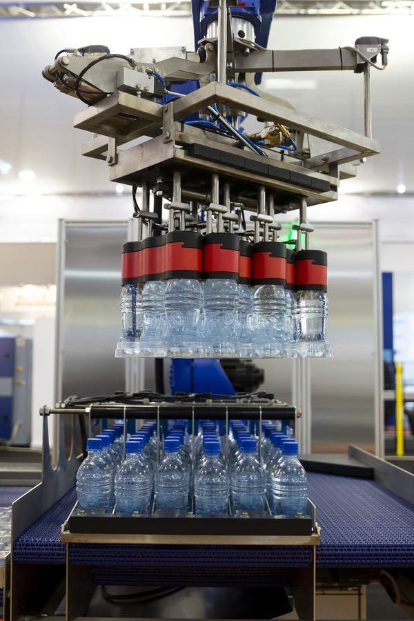 Robotic arm water bottles royalty free stock photos Robotic arm water bottles royalty free stock photos