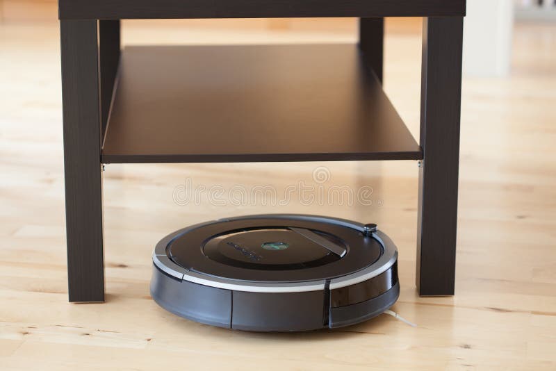 Robotic Vacuum Cleaner on Laminate Wood Floor Smart Cleaning Technology