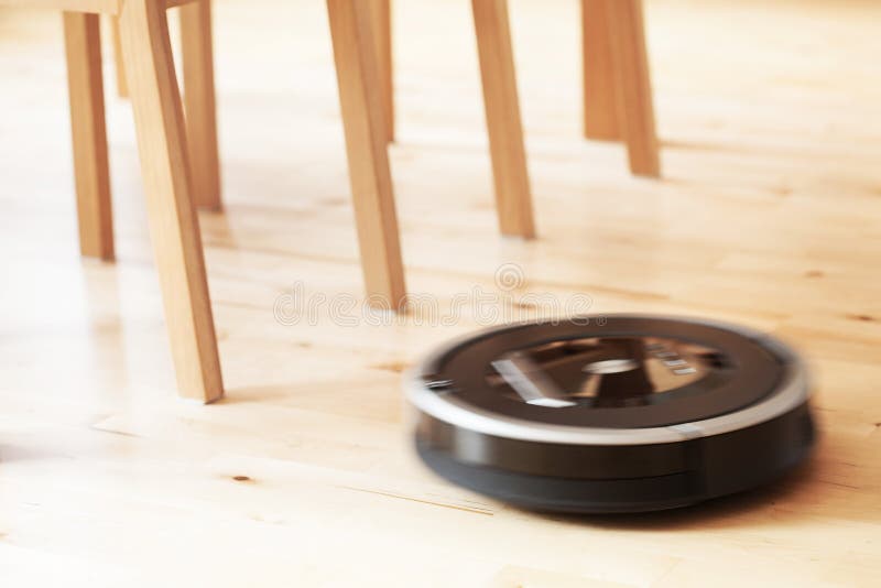 Robotic Vacuum Cleaner on Laminate Wood Floor Smart Cleaning Technology