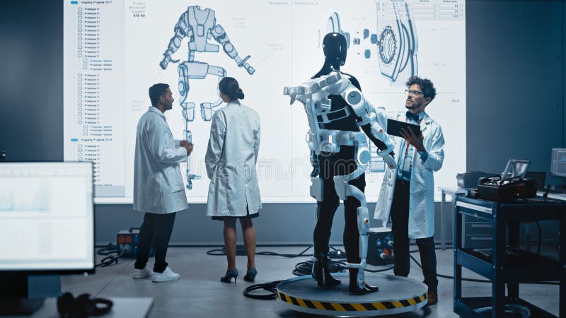 In Robotics Development Laboratory: Female Engineer and Male Scientist Work With Big Screen Showin stock photos