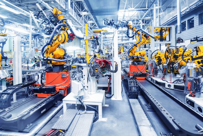 Robots in een autofabriek royalty-vrije stock fotografie Robots in een autofabriek royalty-vrije stock fotografie