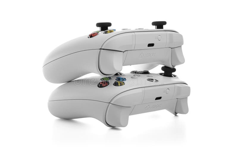 Robotvit trådlöst spel i den trådlösa mikromjuka xbox-styrenheten royaltyfria foton