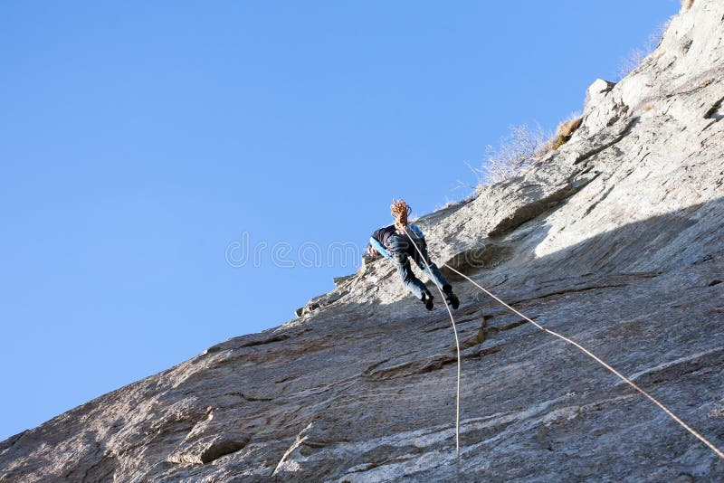 Rock Climber Abseiling Off a Climb Stock Image Image of