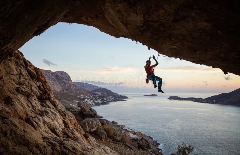 Rock climber hanging on rope after falling of cliff