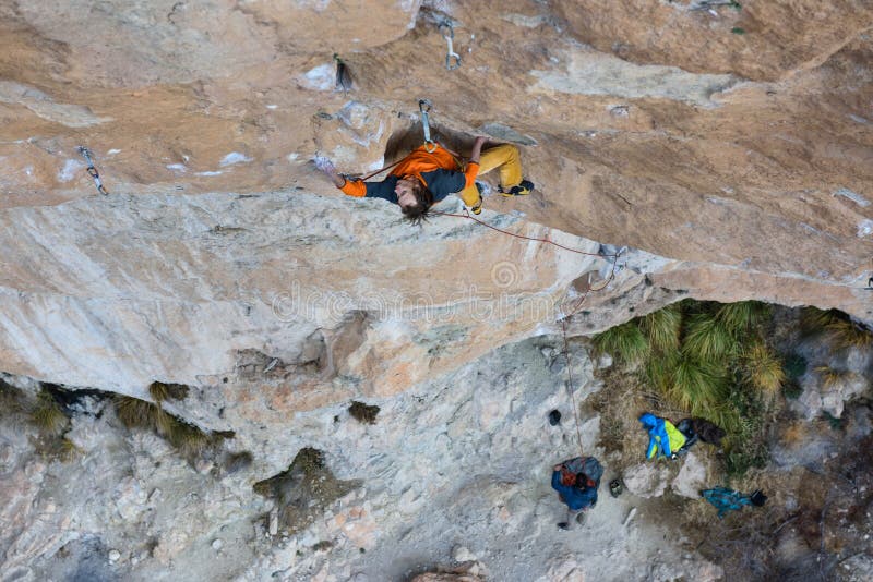 Rock Climber Professional Athlete Climbing A Steep Cliff Extreme