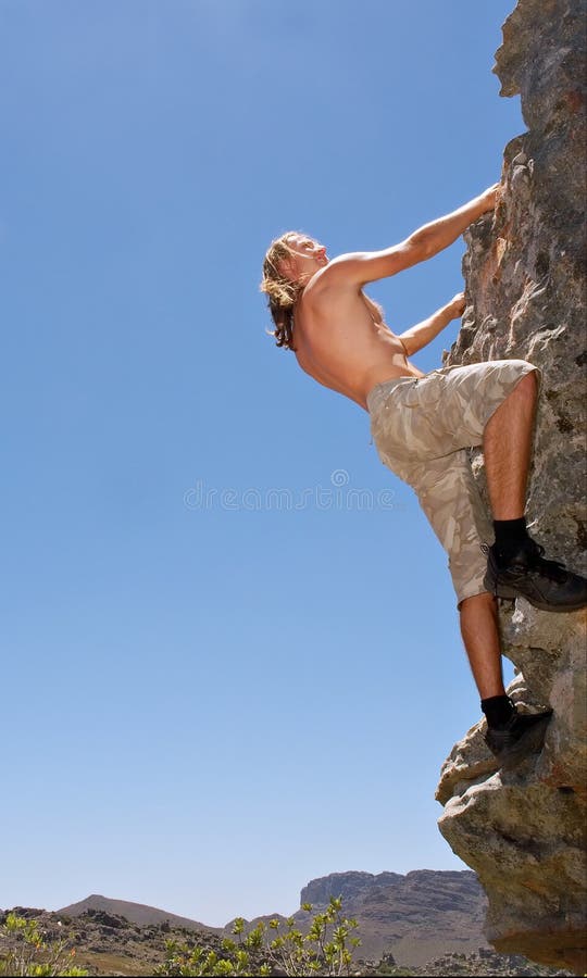 Rock climber on rock scrambles up