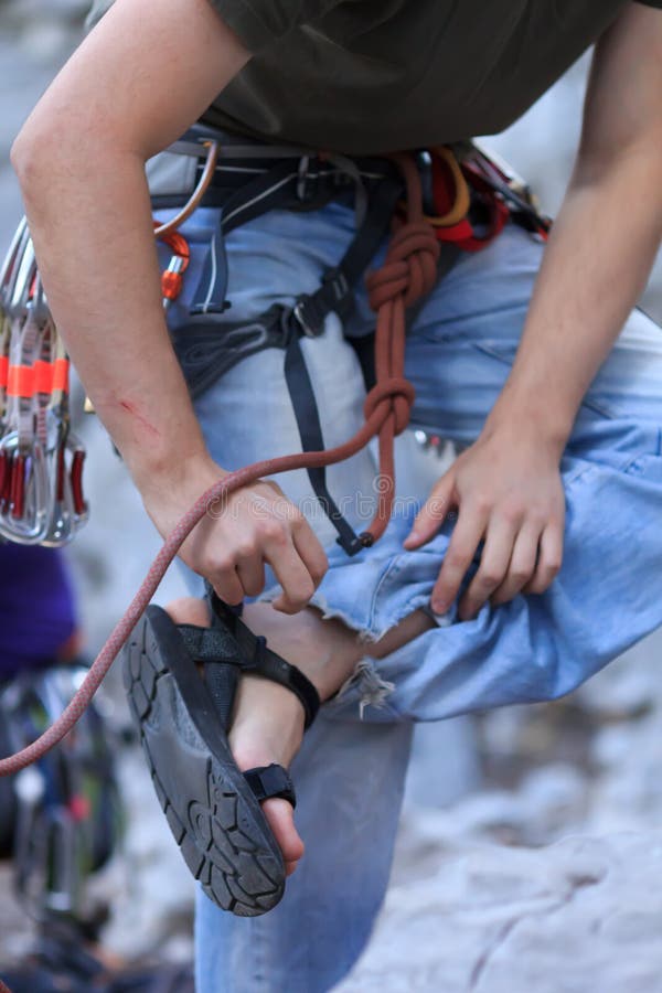 Man prepares for rock climbing. Female climbing high risk building stock images, royalty-free photos and pictures