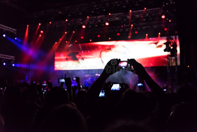 Rock concert, silhouettes of happy people raising up hands stock photos Rock concert, silhouettes of happy people raising up hands stock photos