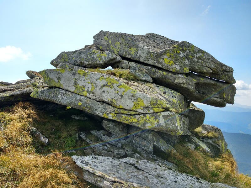 The diversity of the Ukrainian Carpathians. Hiking along a beautiful rocky mountain range in the Ukrainian Carpathians on a warm summer day. The diversity of the Ukrainian Carpathians. Hiking along a beautiful rocky mountain range in the Ukrainian Carpathians on a warm summer day