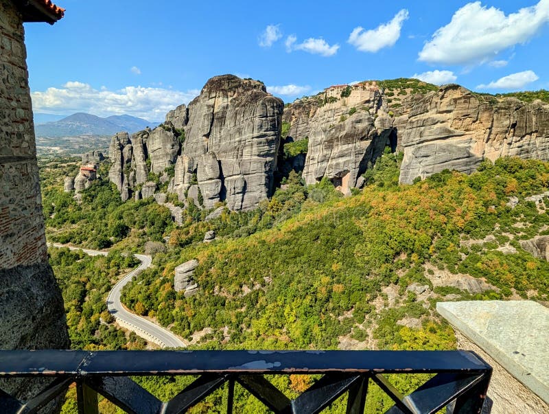 Large rock formations jutting up from the ground in the Meteora region of Greece stock photography