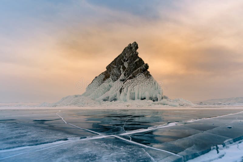 Rock on freezing water lake Siberia Baikal winter season water lake Russia stock photography Rock on freezing water lake Siberia Baikal winter season water lake Russia stock photography
