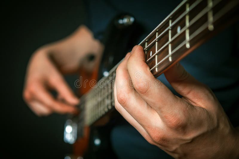 Rock Guitarist Practicing with Bass Guitar. Stock Image Image of