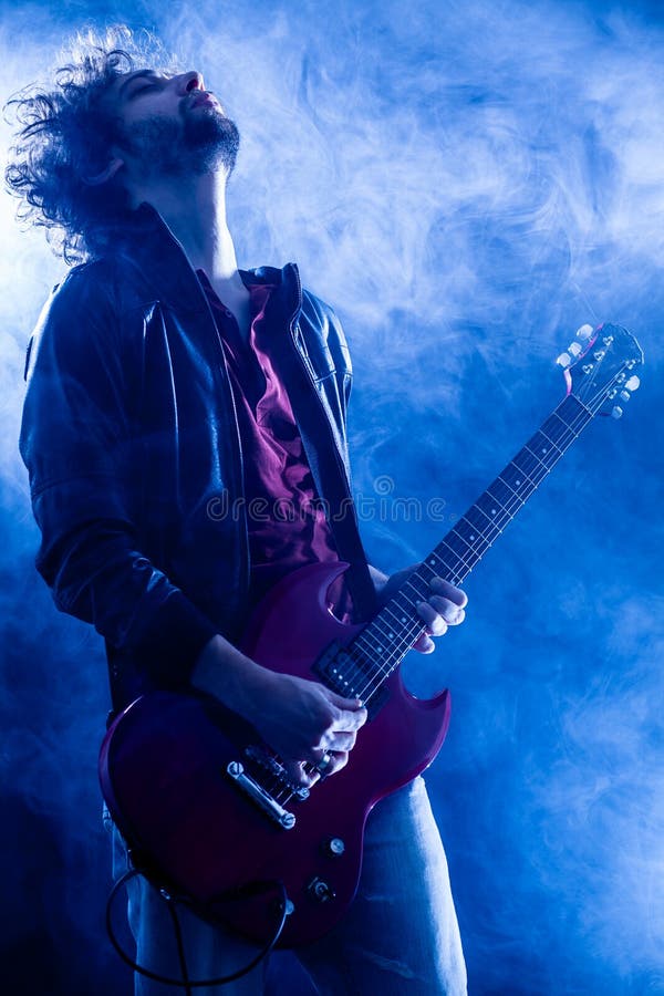 Rock Guitarist stock photo. Image of smoke, play, guitarist 31307796