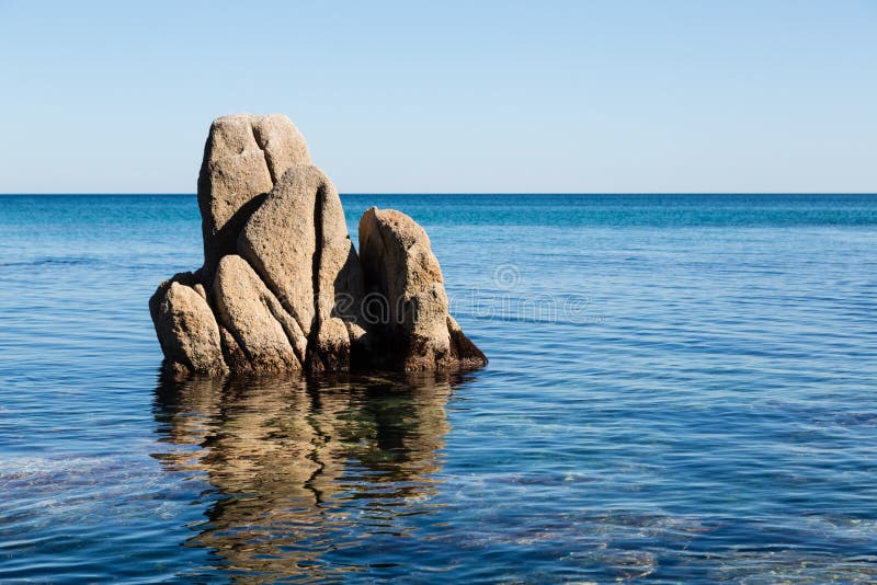 Rock protruding from the sea.